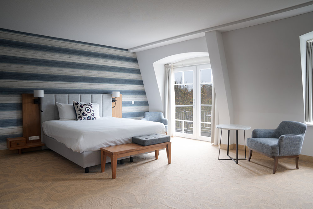 Luxe kamer van Grand Hotel Ter Duin met elegant interieur